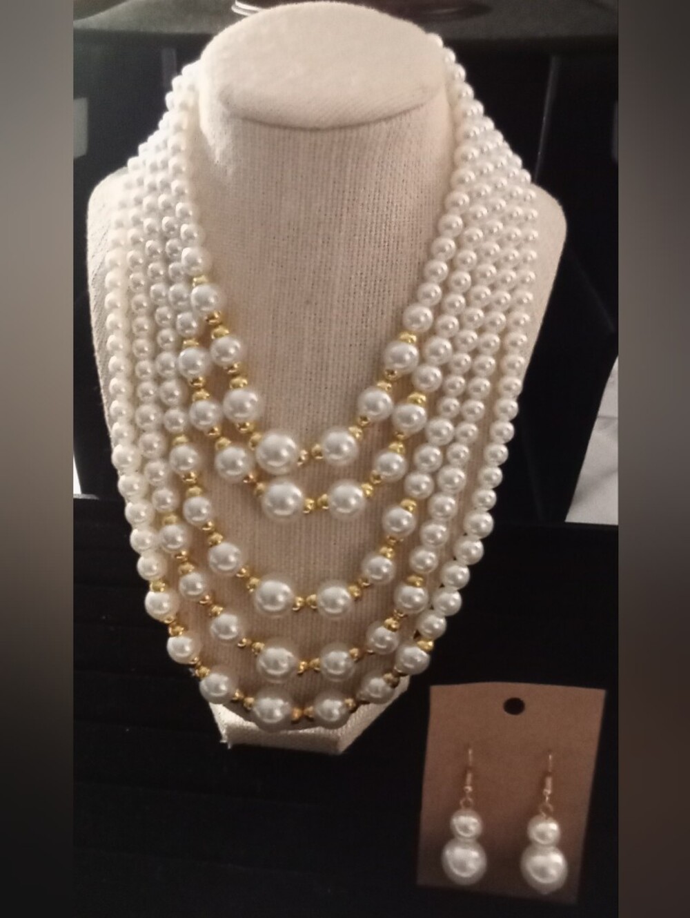 Elegant White Pearl Multi-Strand Necklace with Gold Accents
